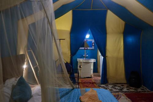 Ένα ή περισσότερα κρεβάτια σε δωμάτιο στο Desert Experience Glamping