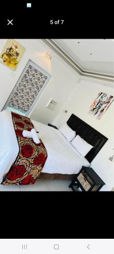 a bedroom with a bed and a laptop on top of it at 27 on Milton in Cape Town