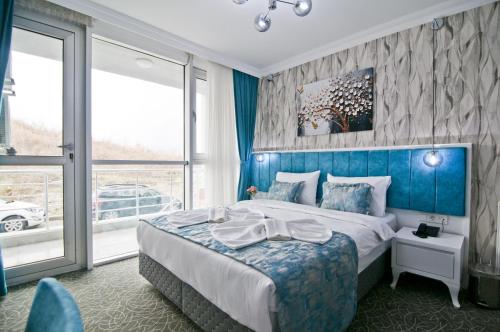 Postel nebo postele na pokoji v ubytování Hill Life Hotel