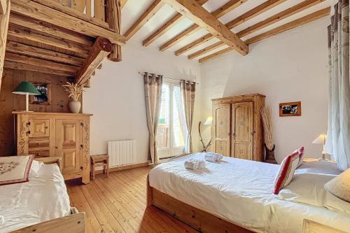 Ένα ή περισσότερα κρεβάτια σε δωμάτιο στο Chalet La Marmottière