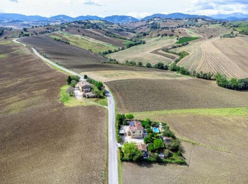 an aerial view of a house in the middle of a field at Casa Silos in Arcevia