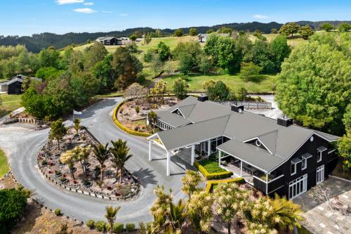 an aerial view of a house with a garden at Woodhouse Mountain Lodge in Warkworth