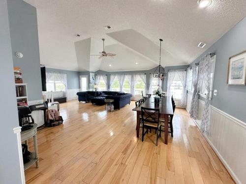 a living room with a table and a couch at CW03 Starfish Serenade in Nags Head