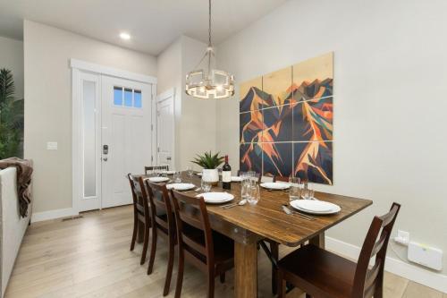 a dining room with a wooden table and chairs at NOCO Retreat with King Beds, Fireplace, Scenic Trails in Loveland