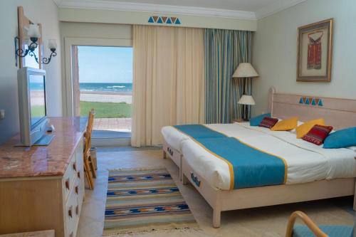 Postel nebo postele na pokoji v ubytování Retac El Arish