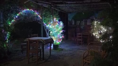 a room with a table and a christmas tree with lights at Departamento 5p Tierra del Sol Eterno - Ica centro in Ica