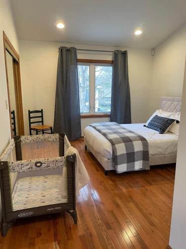 a bedroom with two beds and a window at In Union Pier! By Beach with 5 bedrooms, jacuzzi, yard in Union Pier