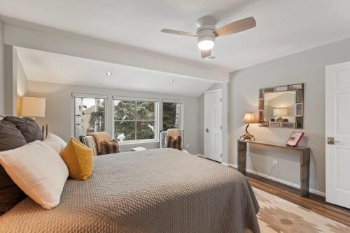 a bedroom with a bed and a ceiling fan at Villa's of Aspen by Snowmass Vacations in Aspen