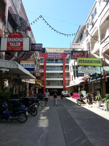 a city street with people walking down the street at Absolute Bangla Suites in Patong Beach
