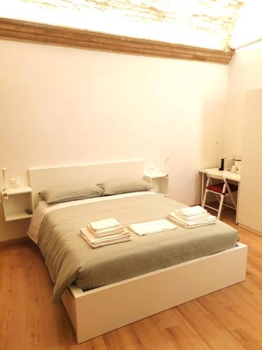 Postel nebo postele na pokoji v ubytování Camere Meccoli
