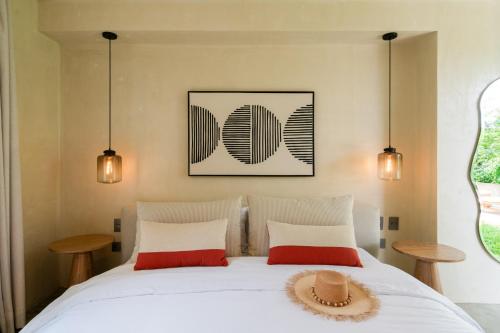 Una cama o camas en una habitación de Hotel Palo Cruz