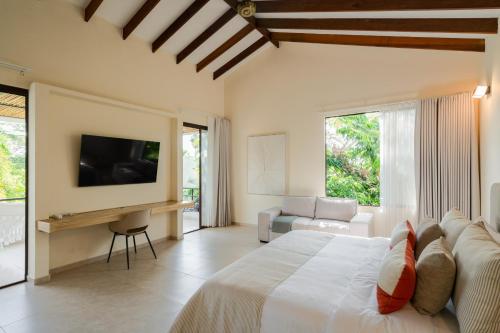 Una cama o camas en una habitación de Hotel Palo Cruz
