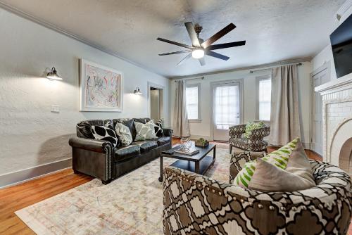 a living room with two couches and a ceiling fan at Lincoln Lodge A near OU Med Bricktown Arena in Oklahoma City