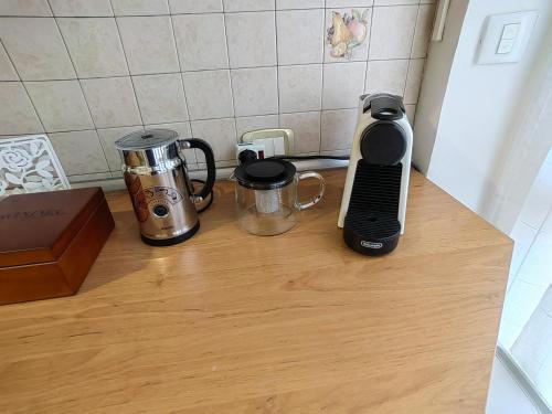a kitchen counter with two coffee makers and a blender at Il maestrale vacation house in Genova