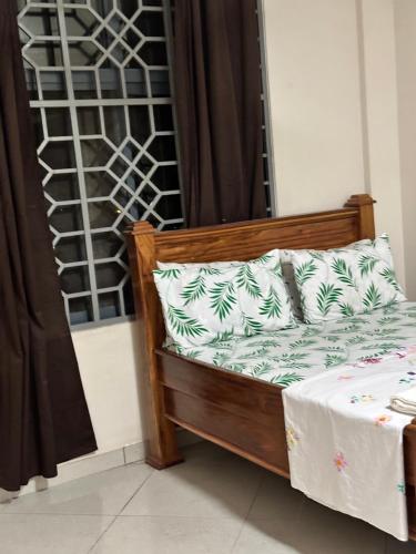 Ένα ή περισσότερα κρεβάτια σε δωμάτιο στο Stay In Zanzibar On A Budget