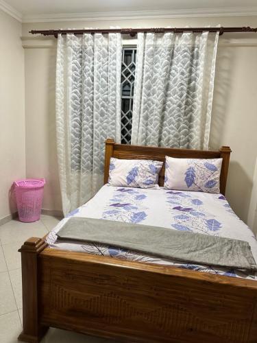 Ένα ή περισσότερα κρεβάτια σε δωμάτιο στο Stay In Zanzibar On A Budget