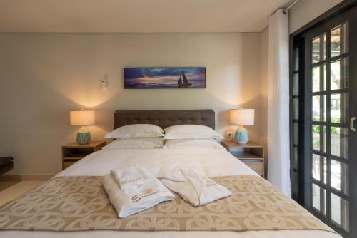 Katil atau katil-katil dalam bilik di SUNSET PORTO BELO Locaçoes