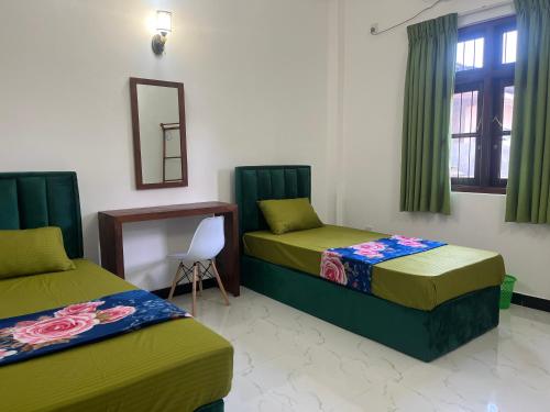 a room with two beds and a mirror at Transit Terminal at colombo airport in Katunayake