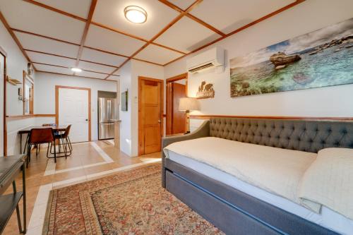 a bedroom with a bed and a table in a room at Grill and Beach Access Cabin in Tahoe Vista! in Tahoe Vista