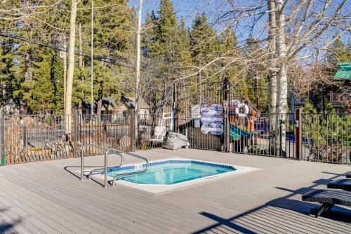 a swimming pool in a yard with a fence at Grill and Beach Access Cabin in Tahoe Vista! in Tahoe Vista