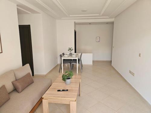 a living room with a couch and a table at La Esmeralda in Tetouan
