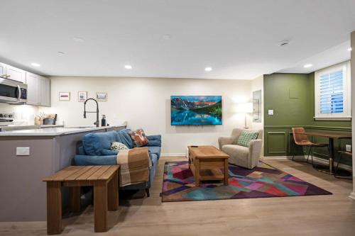 a kitchen and living room with a couch and a table at 2 Blocks from the US Capitol in Washington