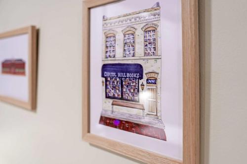 a picture of a building in a frame on a wall at 2 Blocks from the US Capitol in Washington