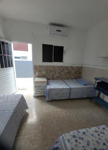 Ένα ή περισσότερα κρεβάτια σε δωμάτιο στο Pousada das Redes