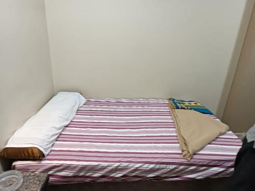Postel nebo postele na pokoji v ubytování فندق الإيمان El Eman Hotel