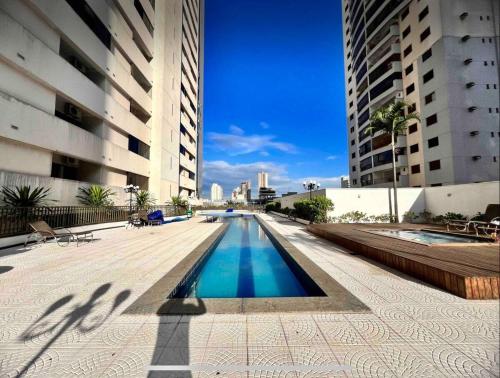 a swimming pool in the middle of a building at Apartamento 2 Dormitórios, Bueno in Goiânia