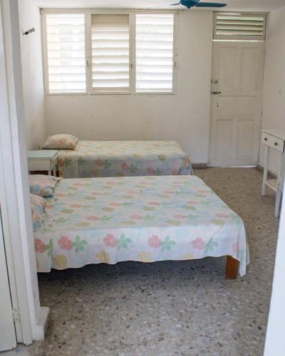 Ένα ή περισσότερα κρεβάτια σε δωμάτιο στο Hotel Walton