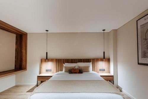 a bedroom with a large bed in a room at 1616 Hotel in Medellín