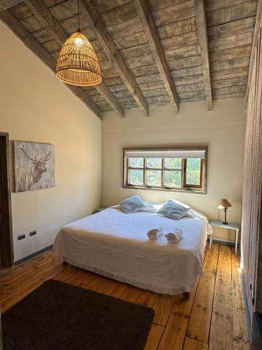 Ein Bett oder Betten in einem Zimmer der Unterkunft Casona el Refugio Casablanca
