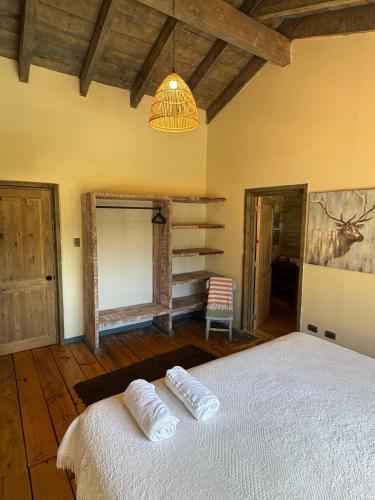 Ein Bett oder Betten in einem Zimmer der Unterkunft Casona el Refugio Casablanca