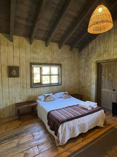 Ein Bett oder Betten in einem Zimmer der Unterkunft Casona el Refugio Casablanca