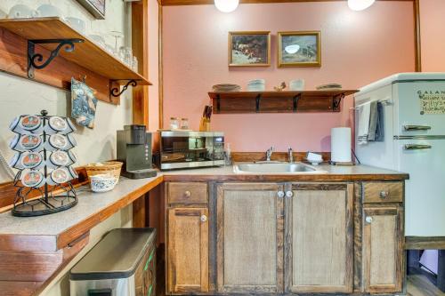 a kitchen with a sink and a refrigerator at Walk to White River Cozy Studio, Driftys Hideaway in Cotter