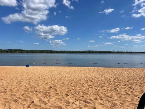 a sandy beach with a view of a body of water at Casa Bella Vista in Bella Vista