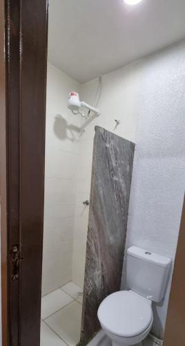 a bathroom with a toilet and a shower at Suíte 302 - Pousada no Centro do Rio in Rio de Janeiro