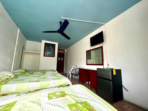 Ένα ή περισσότερα κρεβάτια σε δωμάτιο στο Hotel Walton