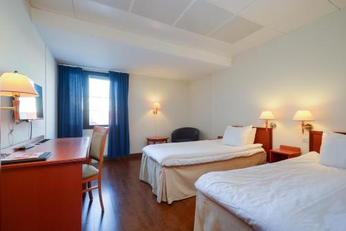 Katil atau katil-katil dalam bilik di Best Western Nya Star Hotel