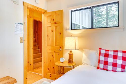 a bedroom with a bed and a window at Less Than 2 Blocks to Lake Tahoe Family Home Near Skiing in Homewood