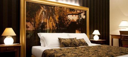 Säng eller sängar i ett rum på Hotel Villaguarda Prosecco Area