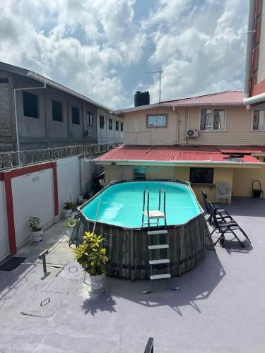 a swimming pool in the middle of a courtyard at Senior Suite 3 Bedroom in Beterverwagting