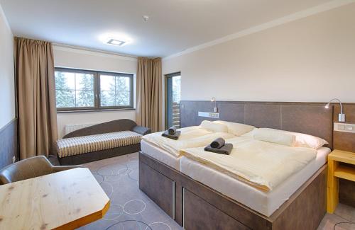 Postel nebo postele na pokoji v ubytování Hotel Orion