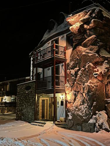 a building with a balcony on the side of a mountain at Alpenfels Zwieselstein in Sölden