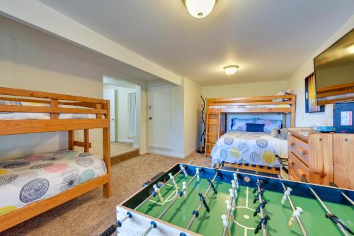 a bedroom with a pool table and two bunk beds at Stunning Idyllwild Home with Private Hot Tub and Decks in Idyllwild
