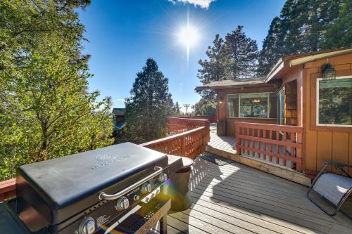 a house with a grill on a deck at Stunning Idyllwild Home with Private Hot Tub and Decks in Idyllwild