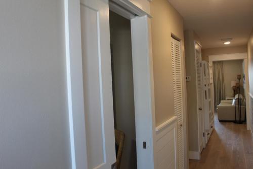 a hallway with a door leading to a bathroom at Summerspell Condominum in Destin