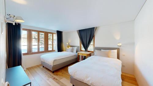 Postel nebo postele na pokoji v ubytování Chalet Rominger-Surlej