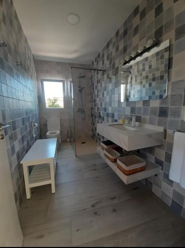 a bathroom with a sink and a mirror at Finca de Luna in La Orotava
